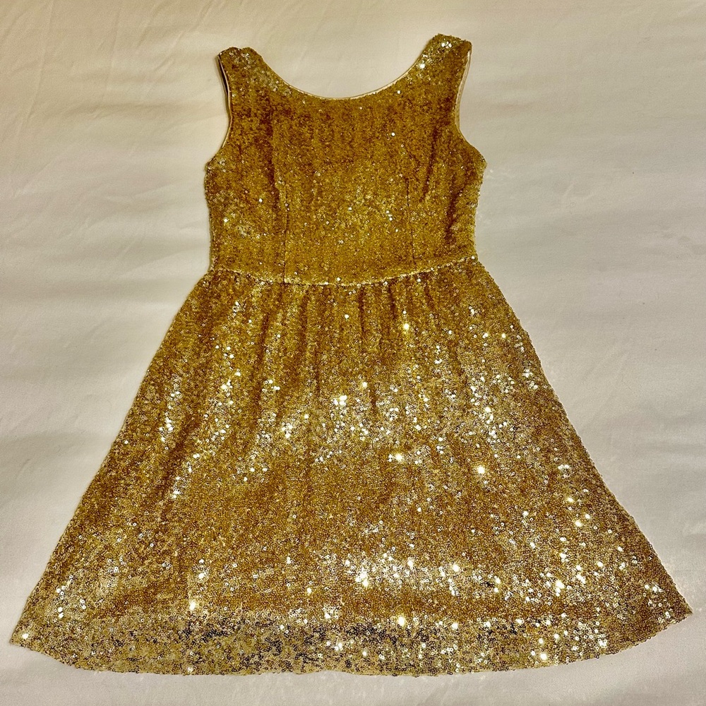 Selling this beautiful gold sequin dress. Only worn once.